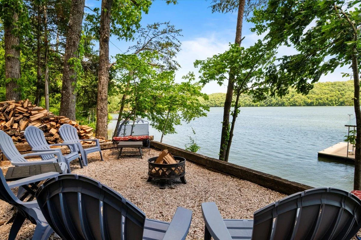 Lakefront fire pit with Adirondack chairs at Parsons Shores Lodge, Norris Lake, Sharps Chapel TN