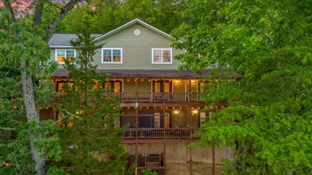 Townhomes lit up at twilight among the trees at Parsons Shores Lodge, Norris Lake, Sharps Chapel TN